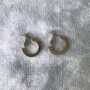 Gold small hoop earrings.
